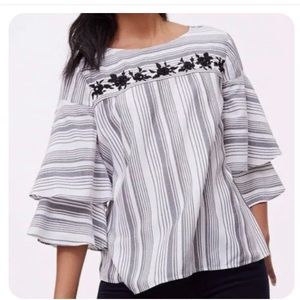 Bell sleeved blouse with sequin detail.